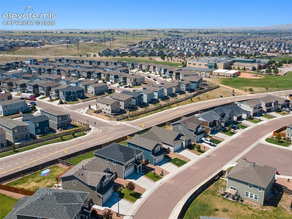Image 42 of 46: Expansive residential community featuring a variety of single-family homes,