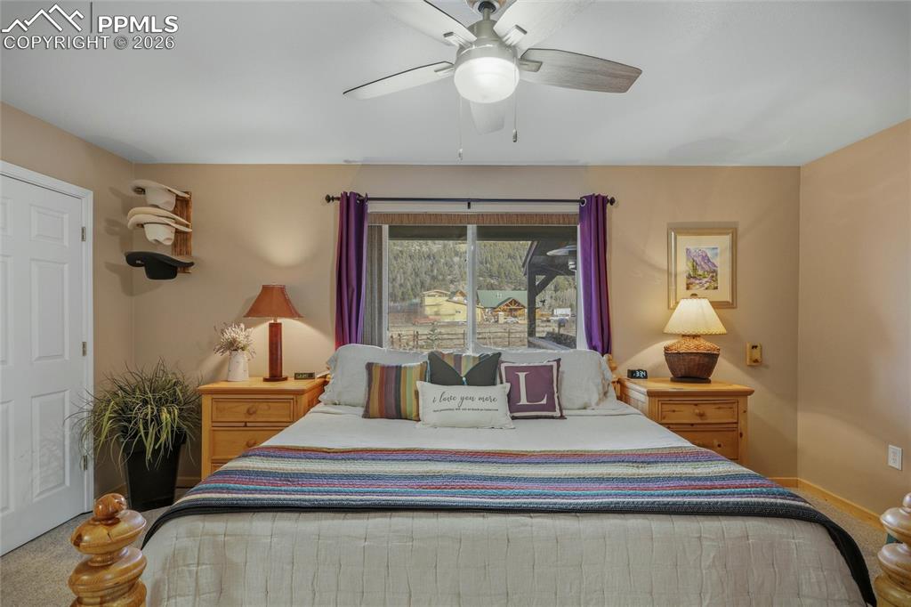 Image 20 of 50: Bedroom featuring carpet floors and ceiling fan