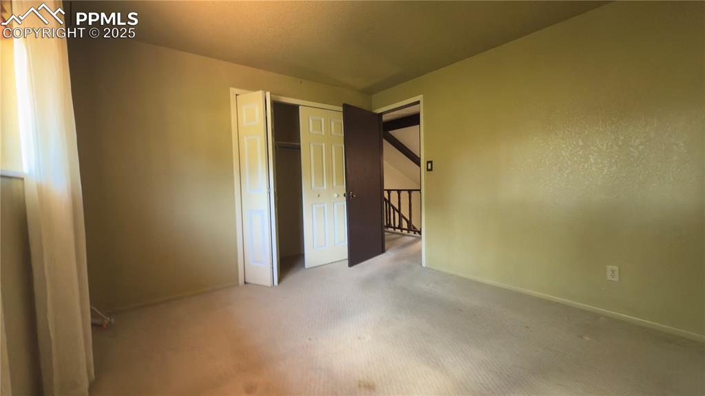 Image 13 of 17: Unfurnished bedroom featuring carpet and a closet