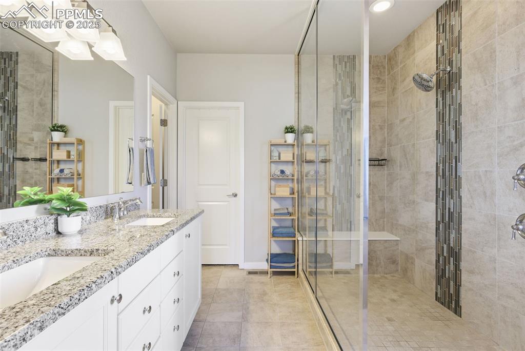 Image 15 of 34: Master bathroom with massive walk-in shower