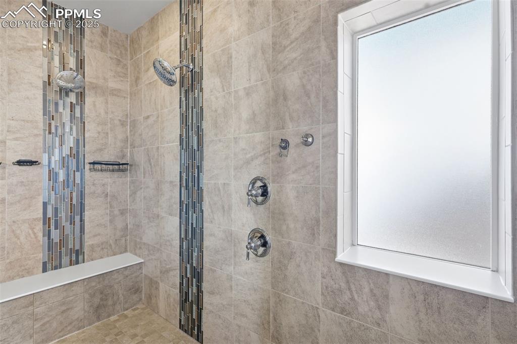 Image 18 of 34: Double shower heads in the extra large shower