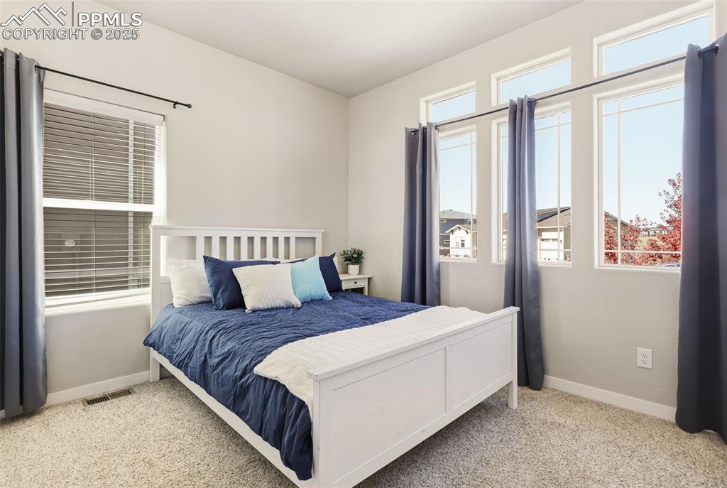 Image 19 of 34: Second bedroom - main level