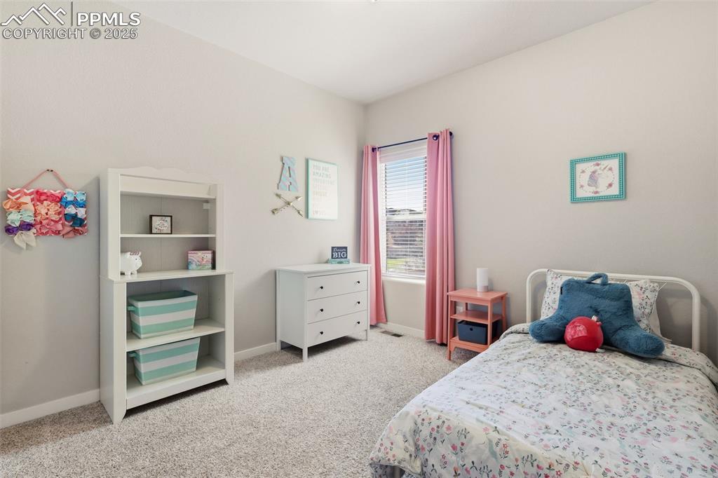 Image 21 of 34: Third bedroom - main level