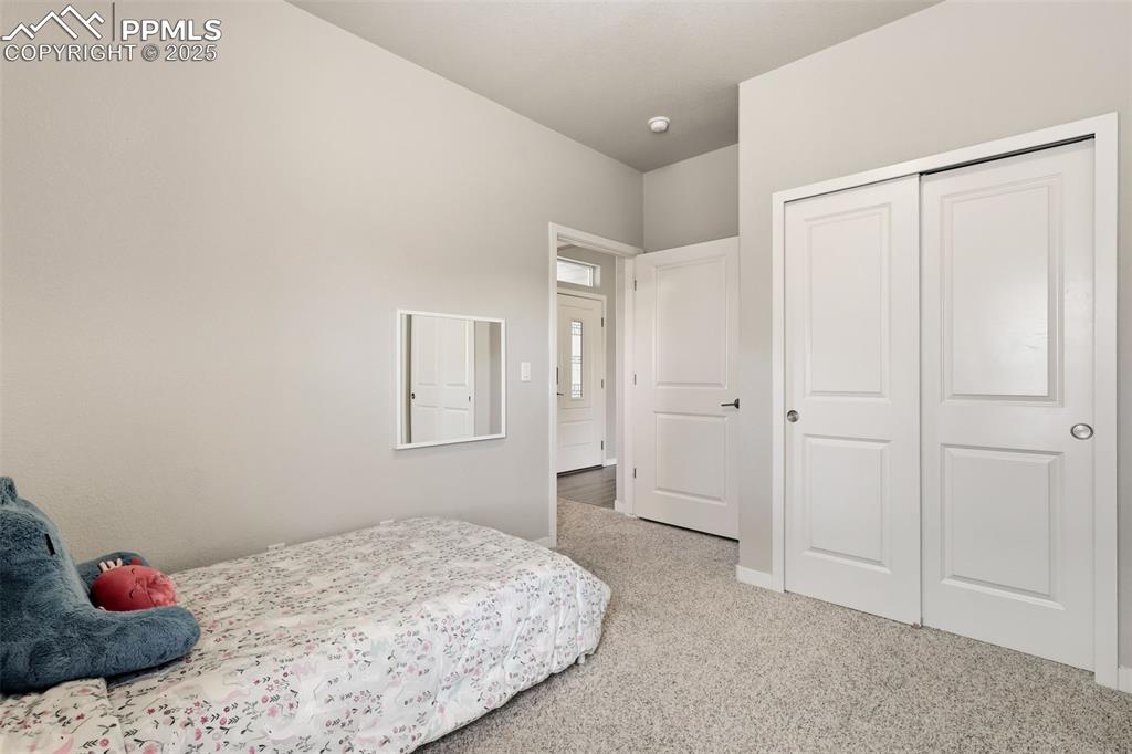 Image 22 of 34: Third bedroom - main level