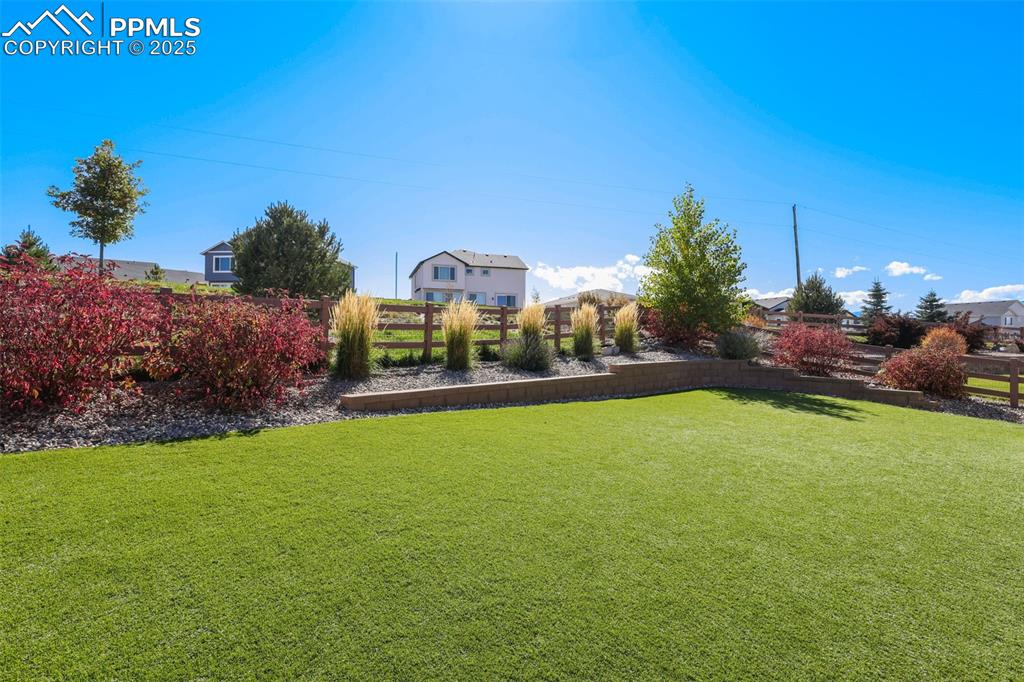 Image 33 of 34: Mature landscaping and turf lawn