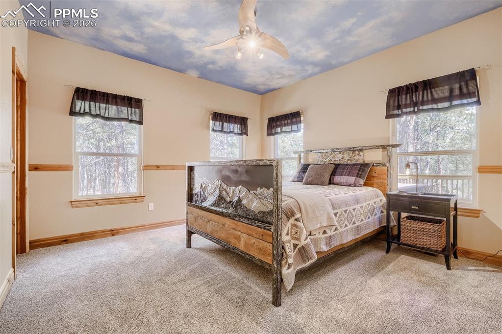 Image 19 of 49: Main level Jr Suite features WIC and full bath w/radiant heated floors.