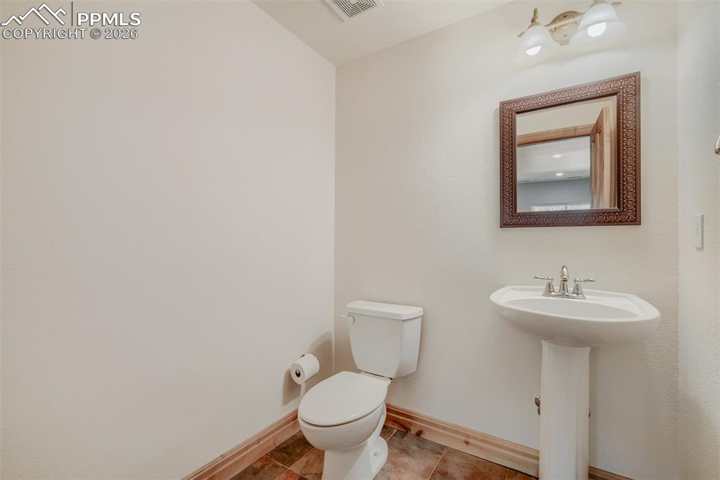 Image 26 of 49: Basement half bathroom