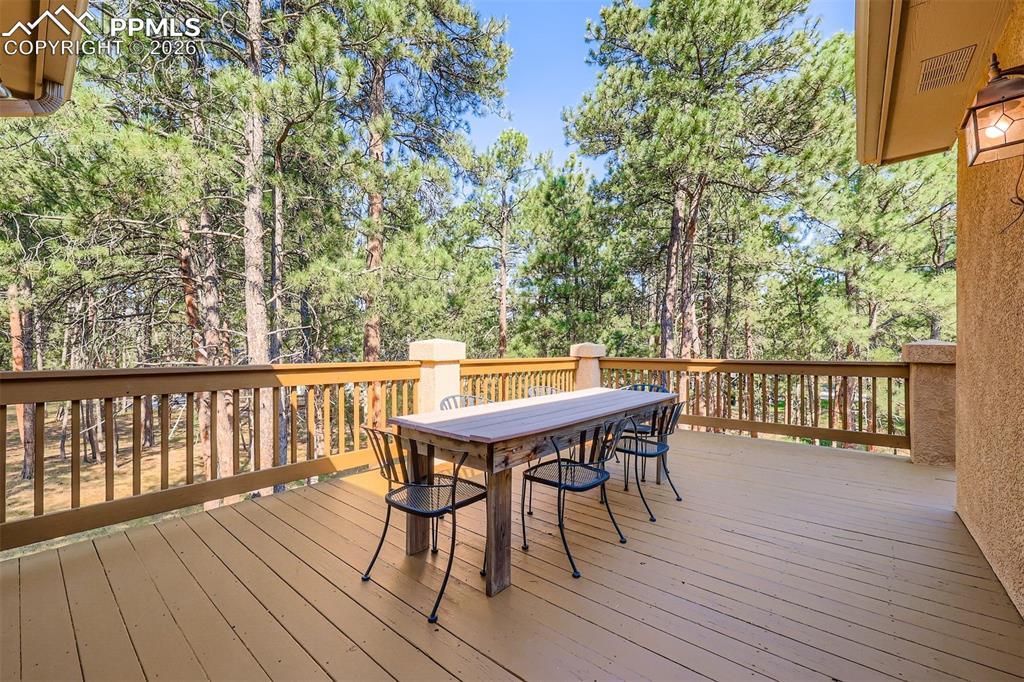 Image 33 of 49: Wooden deck featuring outdoor dining area