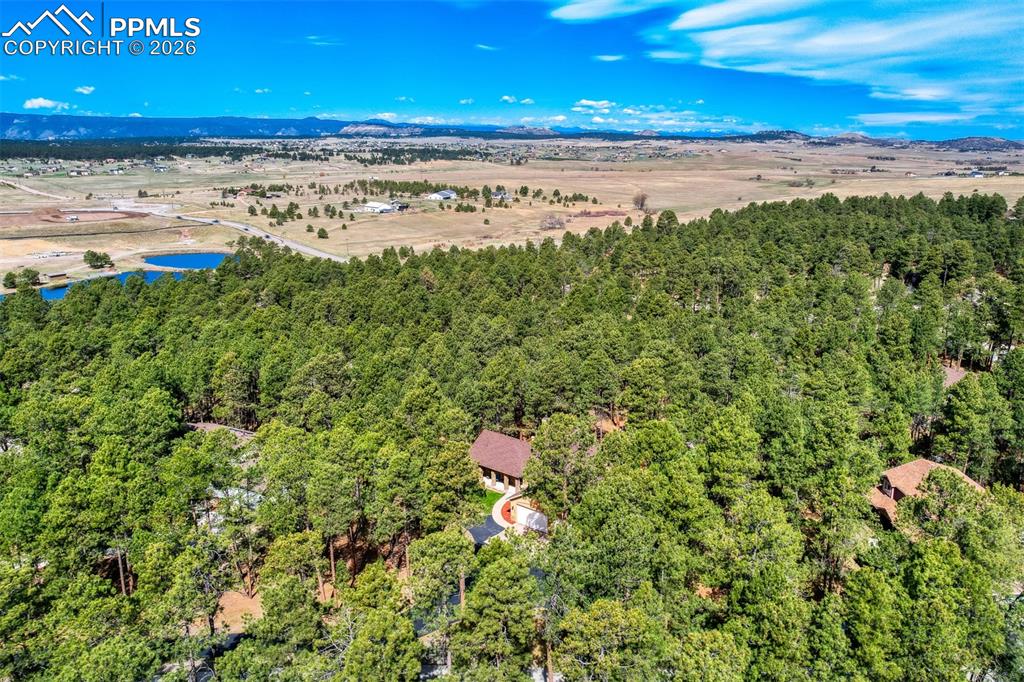 Image 44 of 49: Aerial view of home & mountains