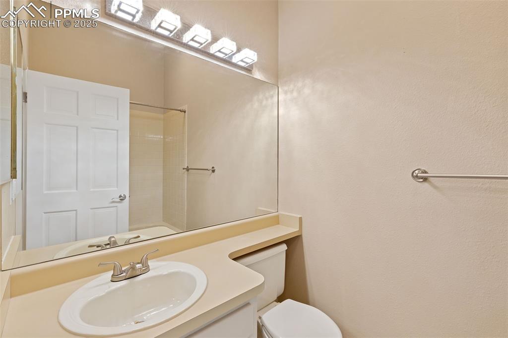 Image 21 of 33: Bathroom featuring a shower and vanity