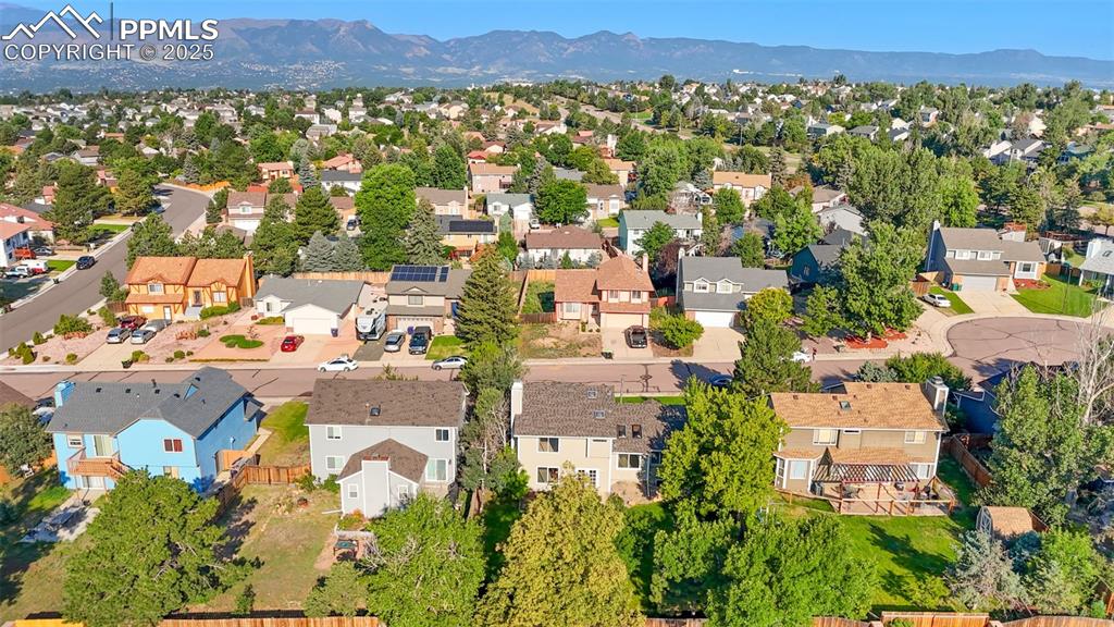 Image 26 of 33: Aerial perspective of suburban area featuring mountains