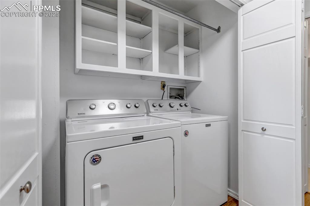 Image 25 of 37: Laundry area with washer and dryer