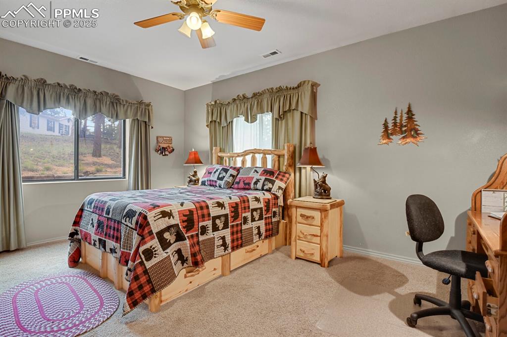 Image 14 of 43: Bedroom featuring light carpet and a ceiling fan