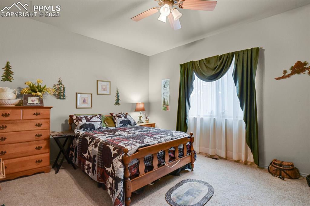 Image 17 of 43: Bedroom featuring carpet and ceiling fan