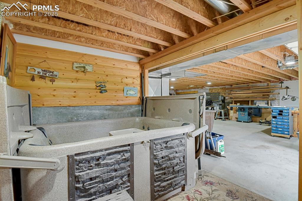 Image 25 of 43: Misc room with concrete floors