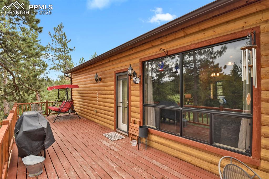 Image 27 of 43: Wooden terrace featuring area for grilling