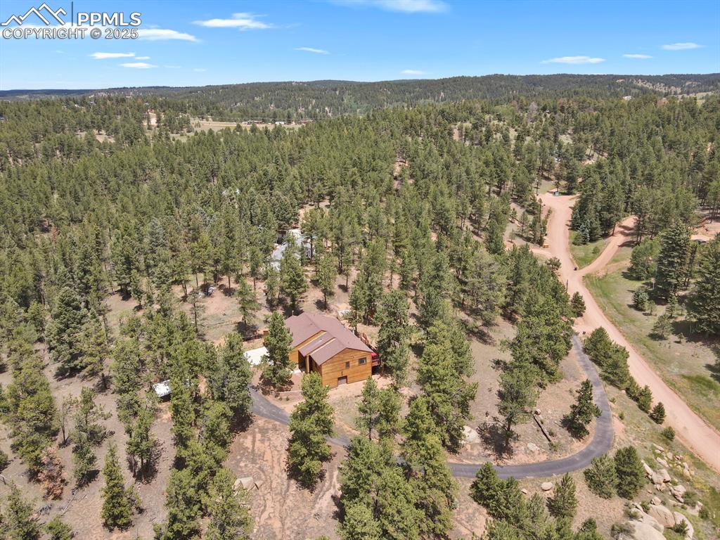 Image 40 of 43: Aerial view of a heavily wooded area