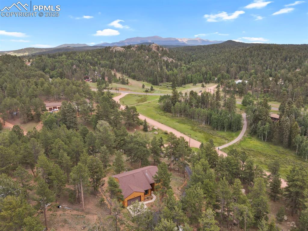 Image 42 of 43: View of property location featuring a mountainous background