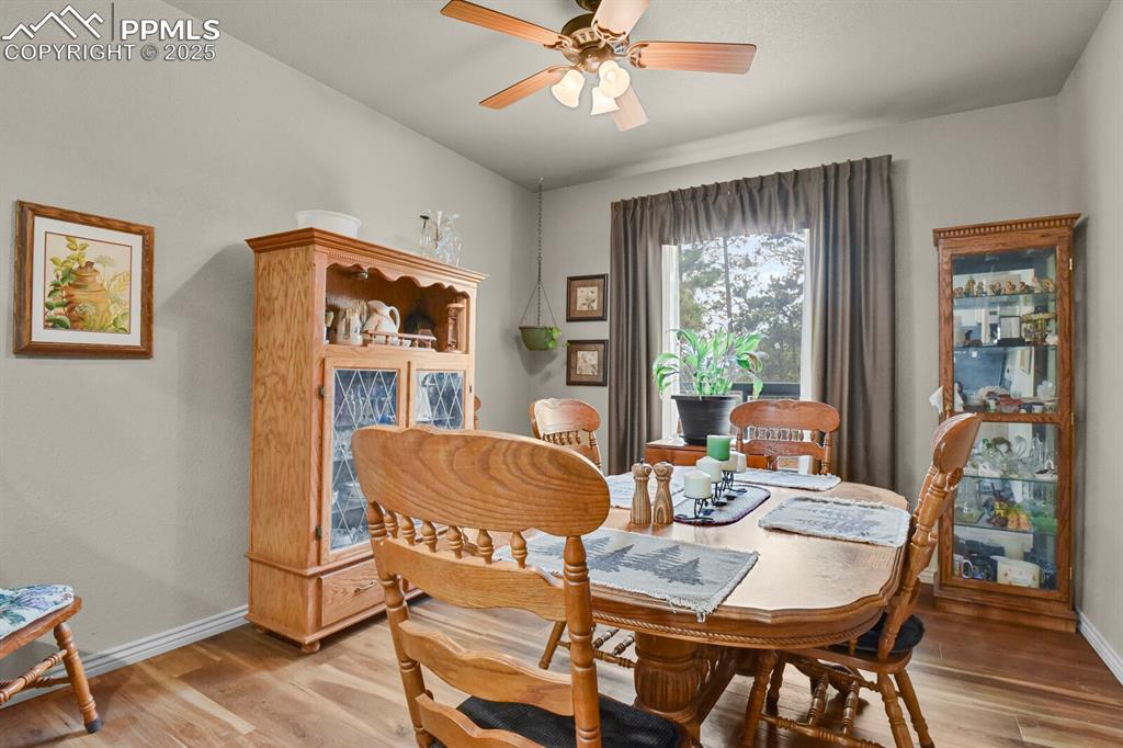 Image 7 of 43: Dining space featuring a ceiling fan and light wood-style flooring
