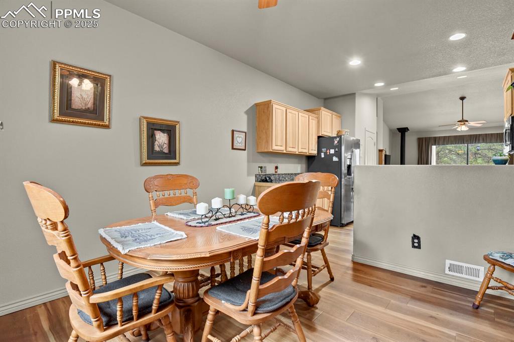 Image 8 of 43: Dining space with a ceiling fan, recessed lighting, and light wood finished