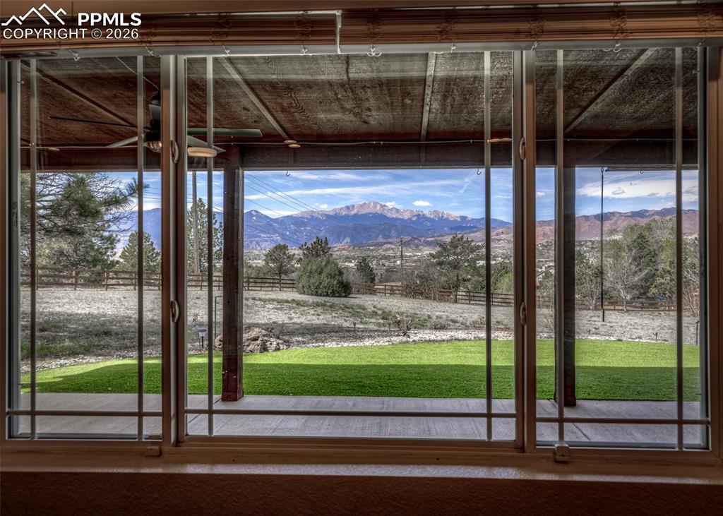 Image 15 of 39: Pikes Peak View thru Dining room window