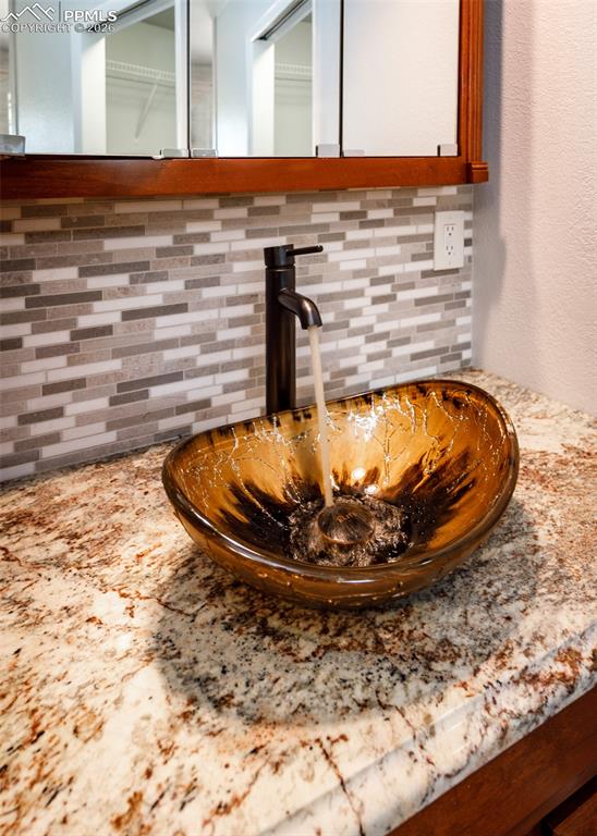 Image 24 of 39: Vessel Sink in primary bathroom