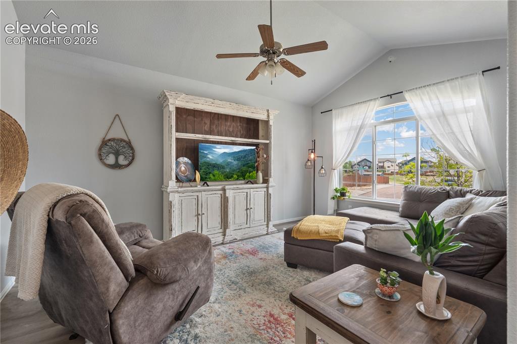 Image 8 of 41: Entryway featuring a paneled door with smart lock, wood-finish flooring, an