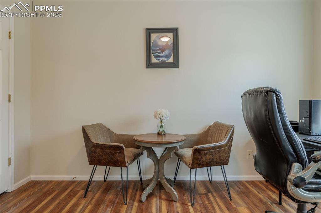 Image 10 of 36: Current owner loves this room for the brightness and uses it as an office/e