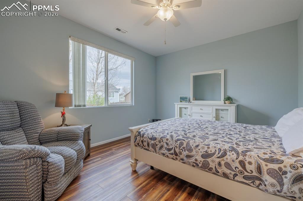 Image 15 of 36: Primary bedroom retreat is light and airy