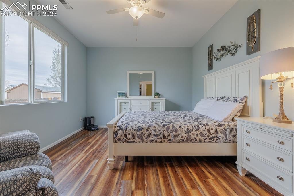 Image 16 of 36: Ample room in primary retreat for a large reading chair or chaise