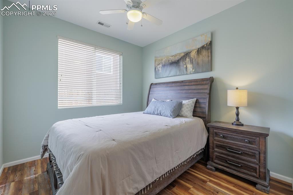 Image 21 of 36: bedroom off the primary retreat with an abundance of light