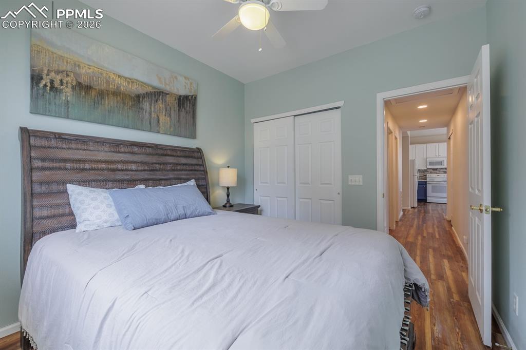 Image 22 of 36: Hall off of bedroom to full bathroom, laundry and garage