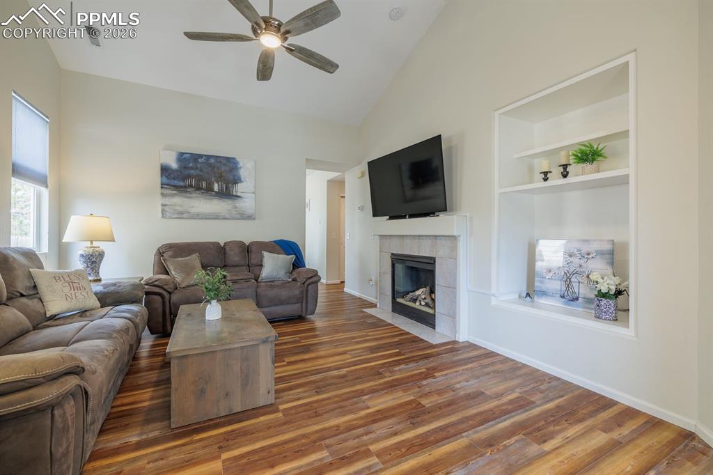 Image 4 of 36: Light and bright living room. Ceilings were scraped and interior of home pa