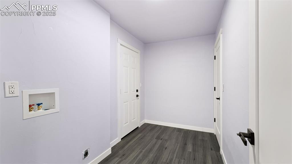 Image 13 of 28: Washroom featuring hookup for a washing machine, dark wood-type flooring, a