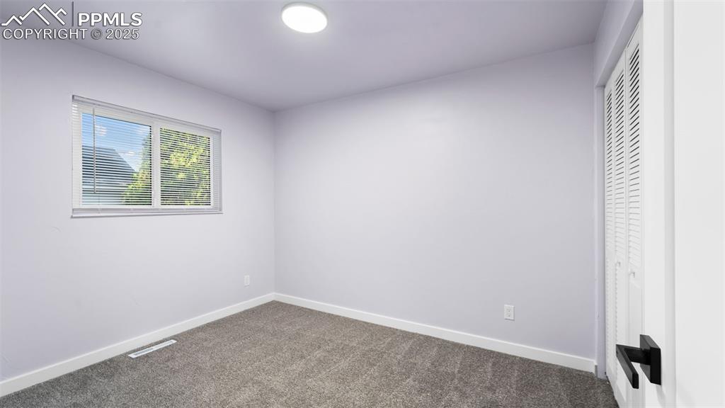 Image 14 of 28: Unfurnished bedroom featuring carpet floors and a closet