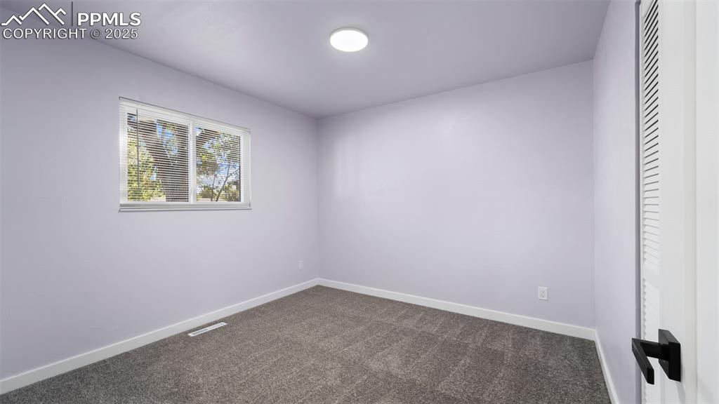 Image 17 of 28: Unfurnished bedroom featuring carpet floors and baseboards