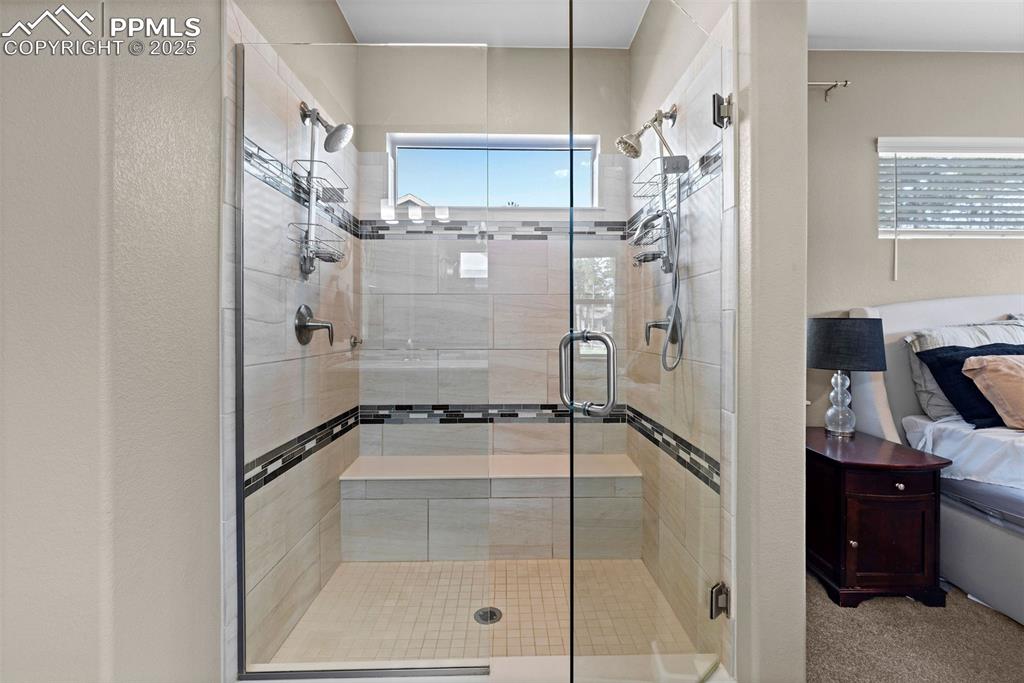 Image 24 of 40: Primary bath walk-in shower