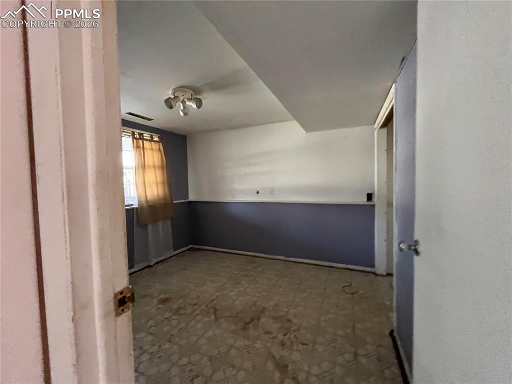 Image 7 of 13: Empty room with tile patterned floors