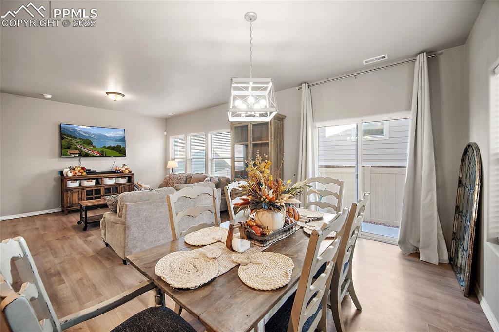 Image 12 of 36: Dining area with walk out to fully fenced back yard and patio.