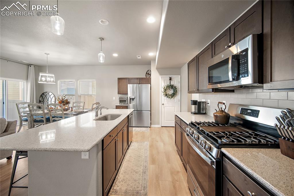 Image 9 of 36: Quartz counter top and tons of cabinet space