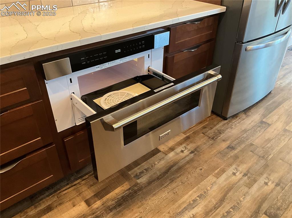 Image 10 of 50: Kitchen with a ZLINE drawer microwave oven.