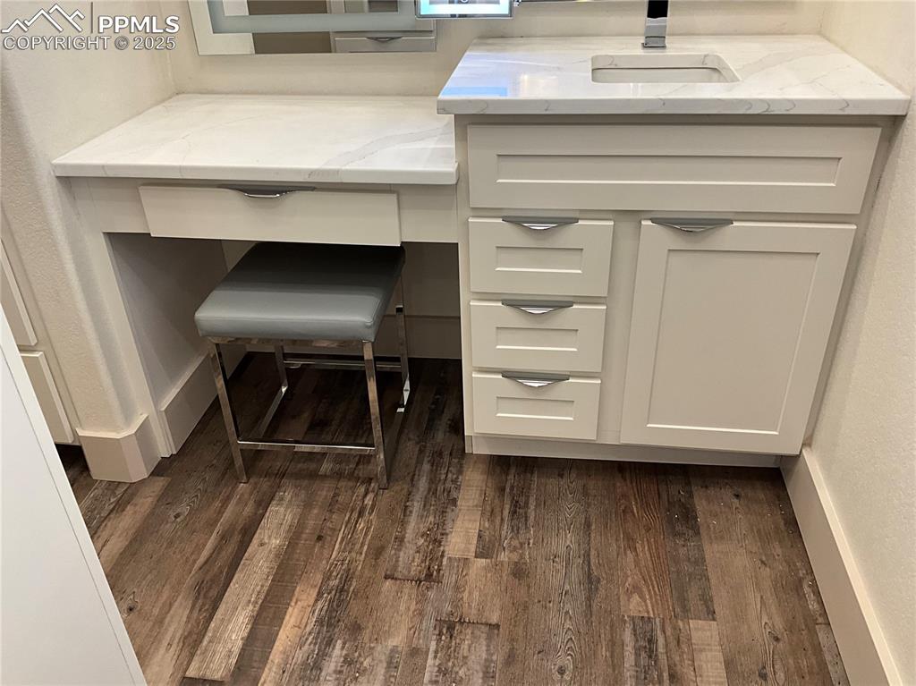 Image 21 of 50: Detailed view of sink and vanity off the bedroom