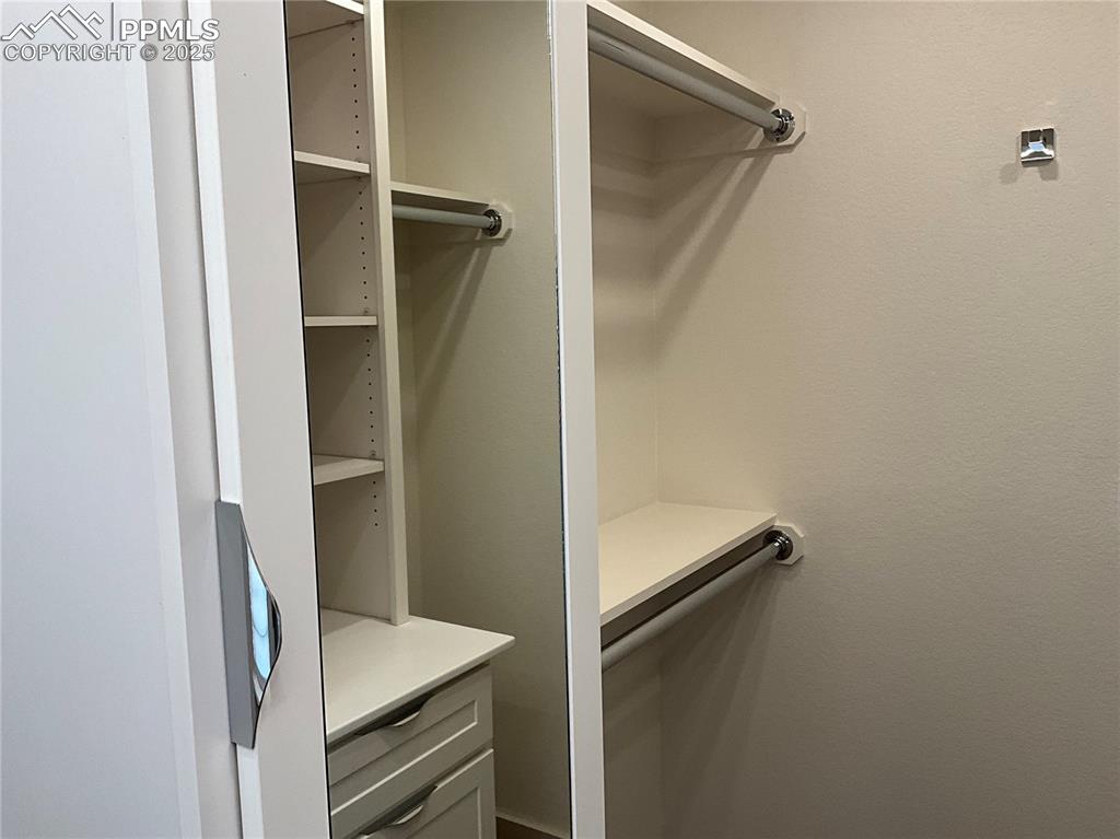 Image 24 of 50: View of spacious walk-in closet