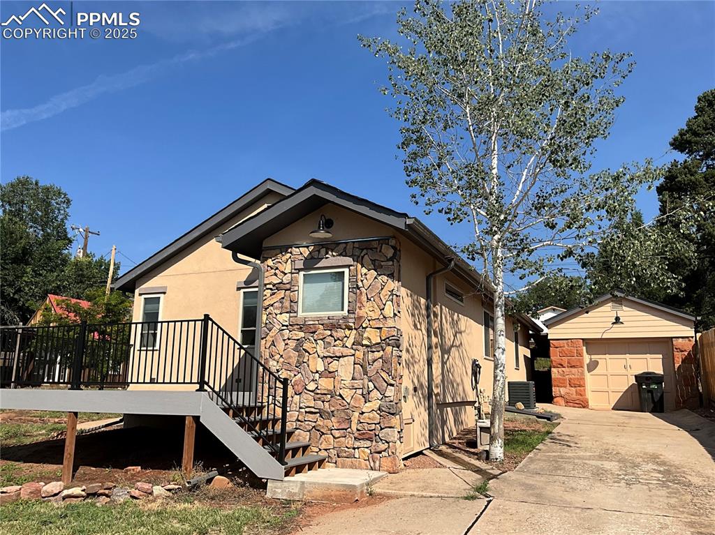 Image 3 of 50: Front view, driveway and 1 car garage