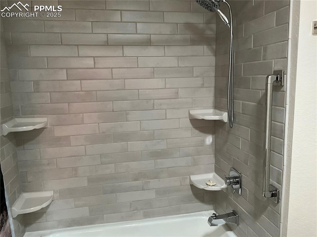 Image 31 of 50: Full bathroom with shower combination