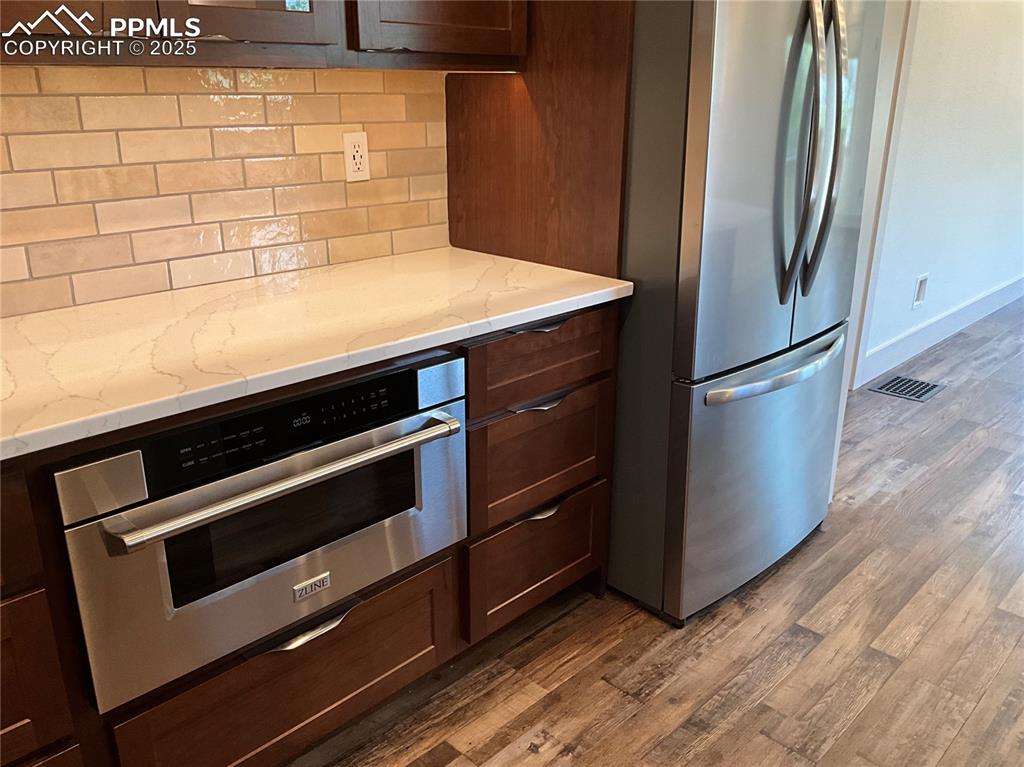 Image 9 of 50: Kitchen featuring a ZLINE drawer microwave oven.