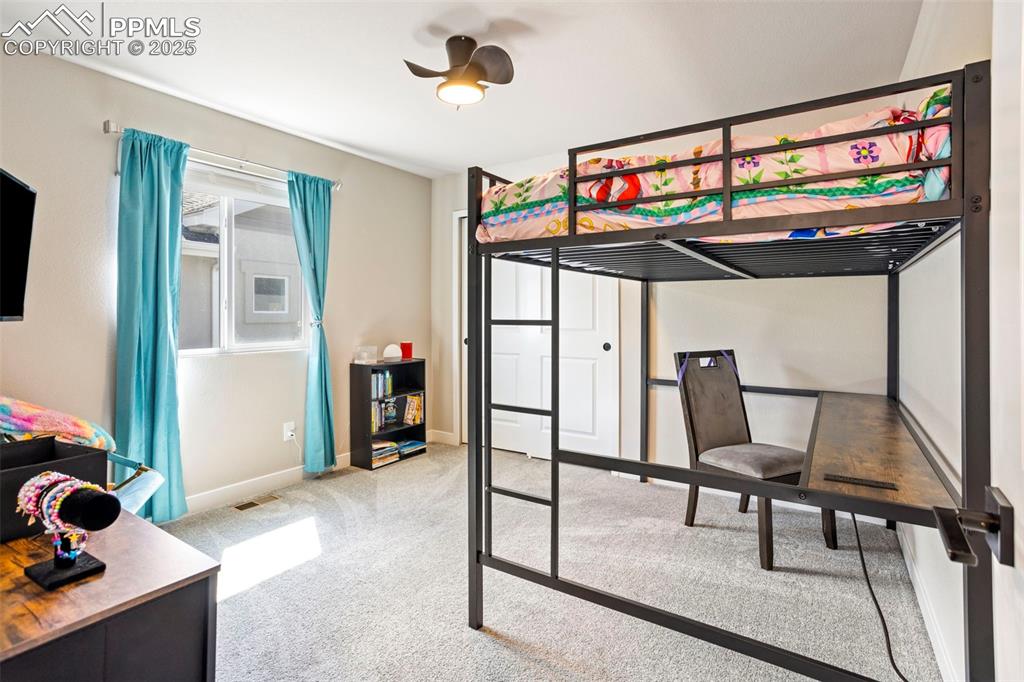Image 26 of 41: Bedroom featuring light carpet and ceiling fan