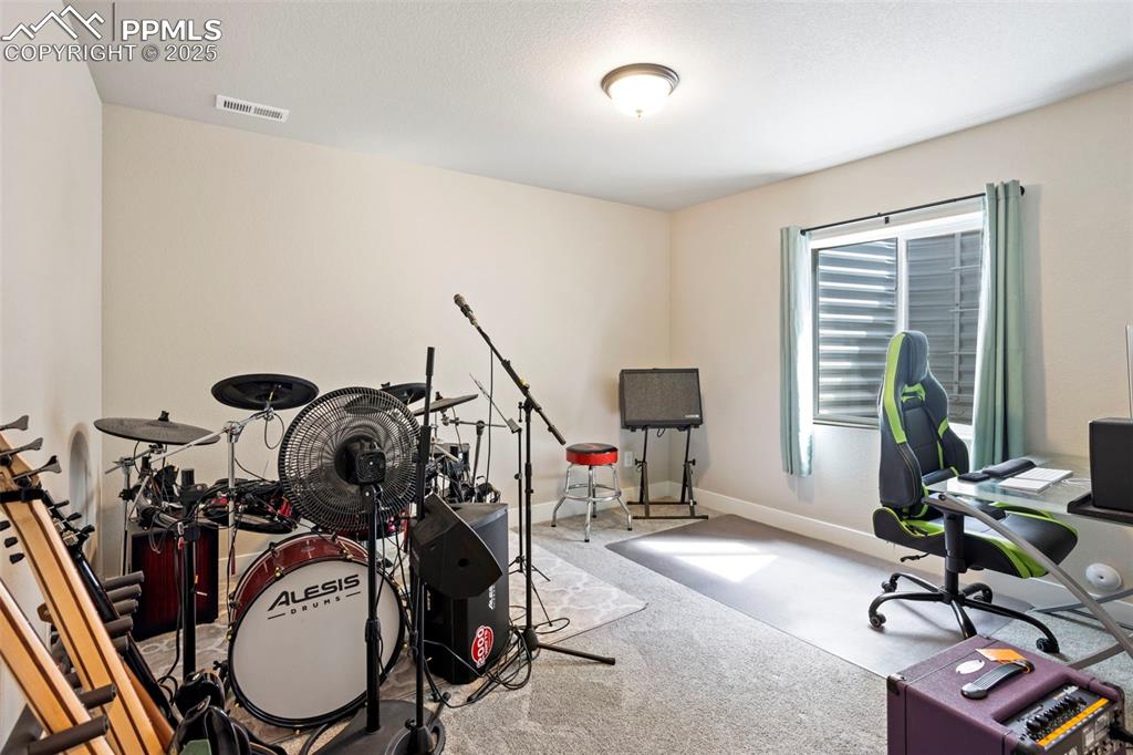 Image 39 of 41: Playroom featuring carpet floors and an office area
