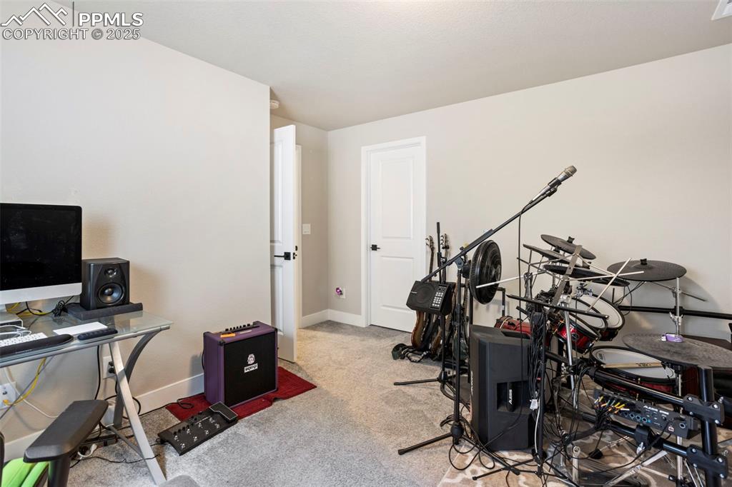 Image 40 of 41: Office area featuring light colored carpet and baseboards