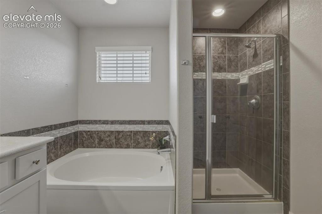 Image 13 of 25: Soaking Tub, Freestanding Shower